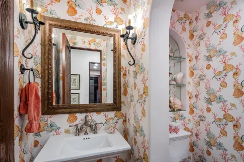a bathroom with a sink and a mirror