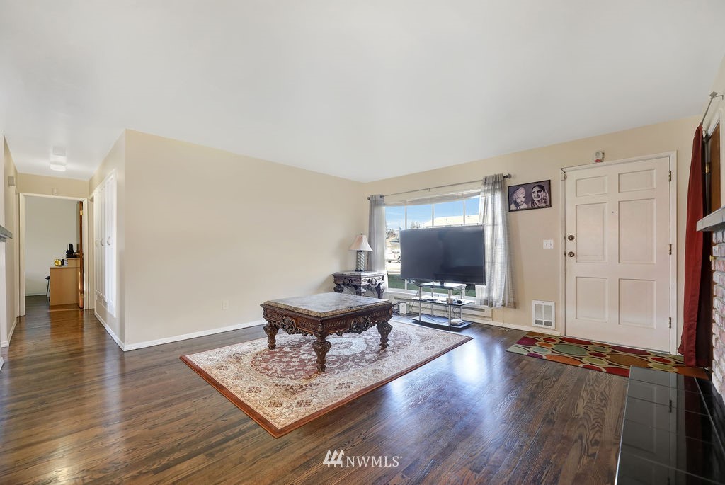 4107 Northeast 10th Street Renton, WA 98059 - Photo 4 of 33 a living room with couch and a wooden floor