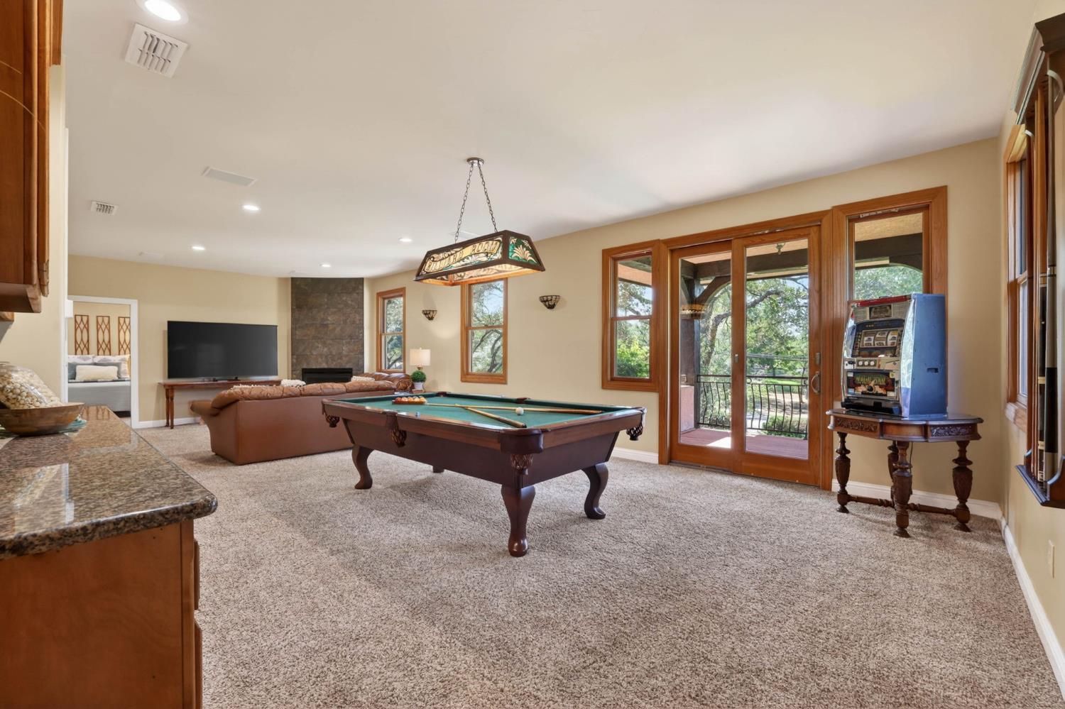7021 Horseshoe Bar Road Loomis, CA 95650 - Photo 33 of 77 Upstairs bonus room with pool table, seating area, and access to the private covered balcony.