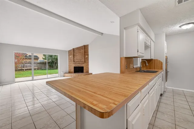 a room with a bed and a fireplace