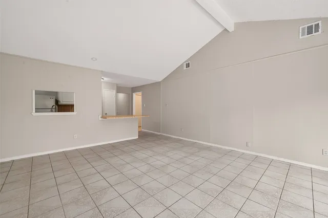 a view of an empty room and window