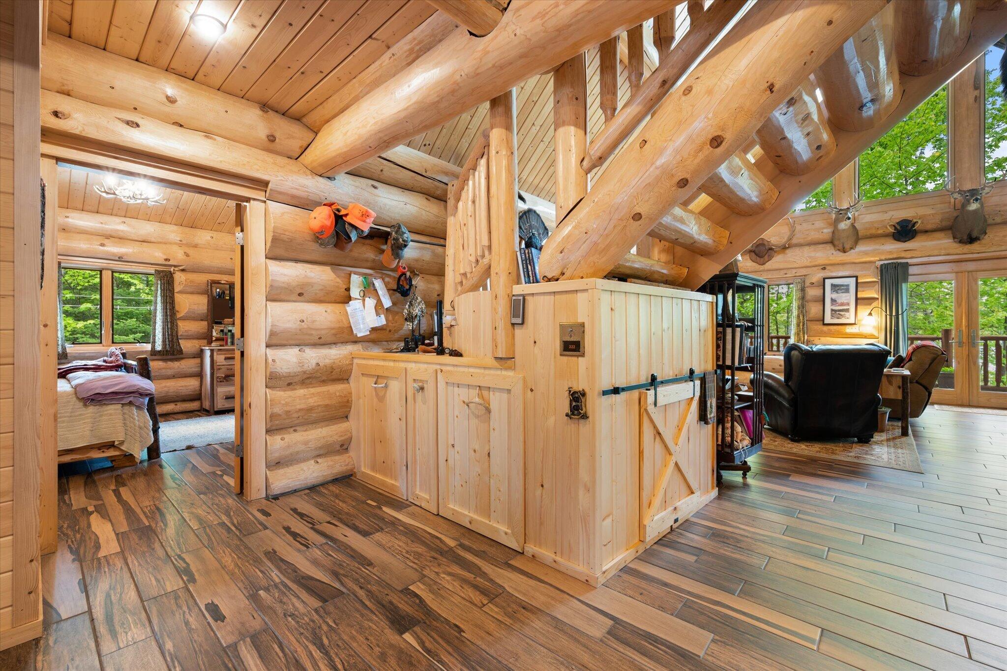 314 Atwood Pond Road Patten, ME 04765 - Photo 34 of 76 Stairway to second level...