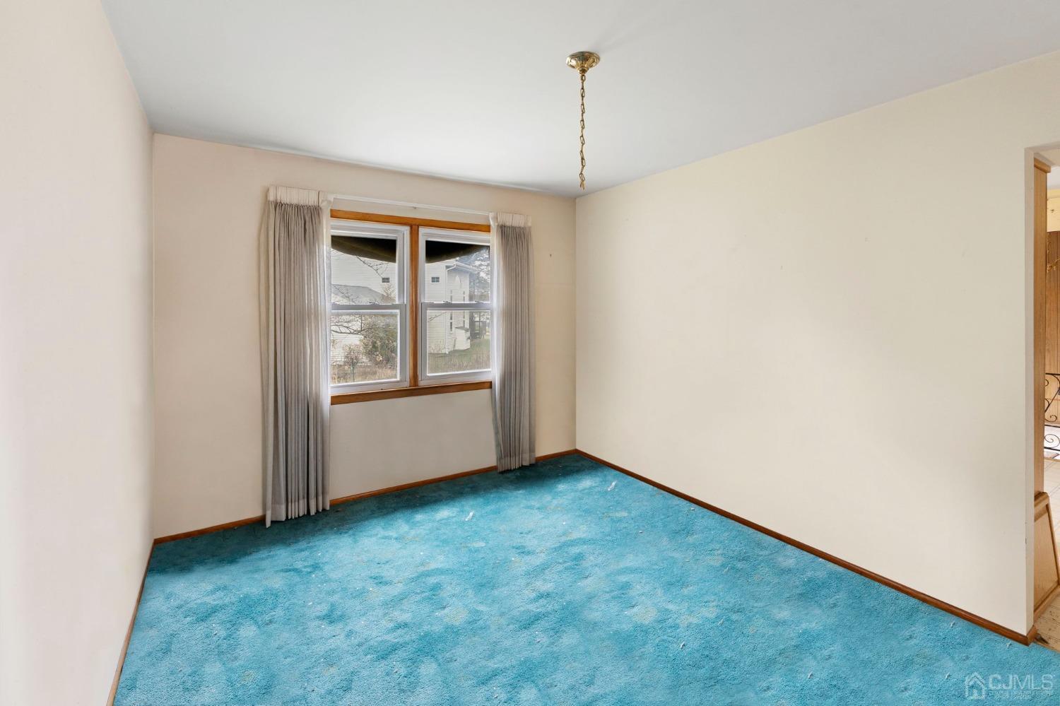 8 Mathison Place Milltown, NJ 08850 - Photo 10 of 17 a view of an empty room and window