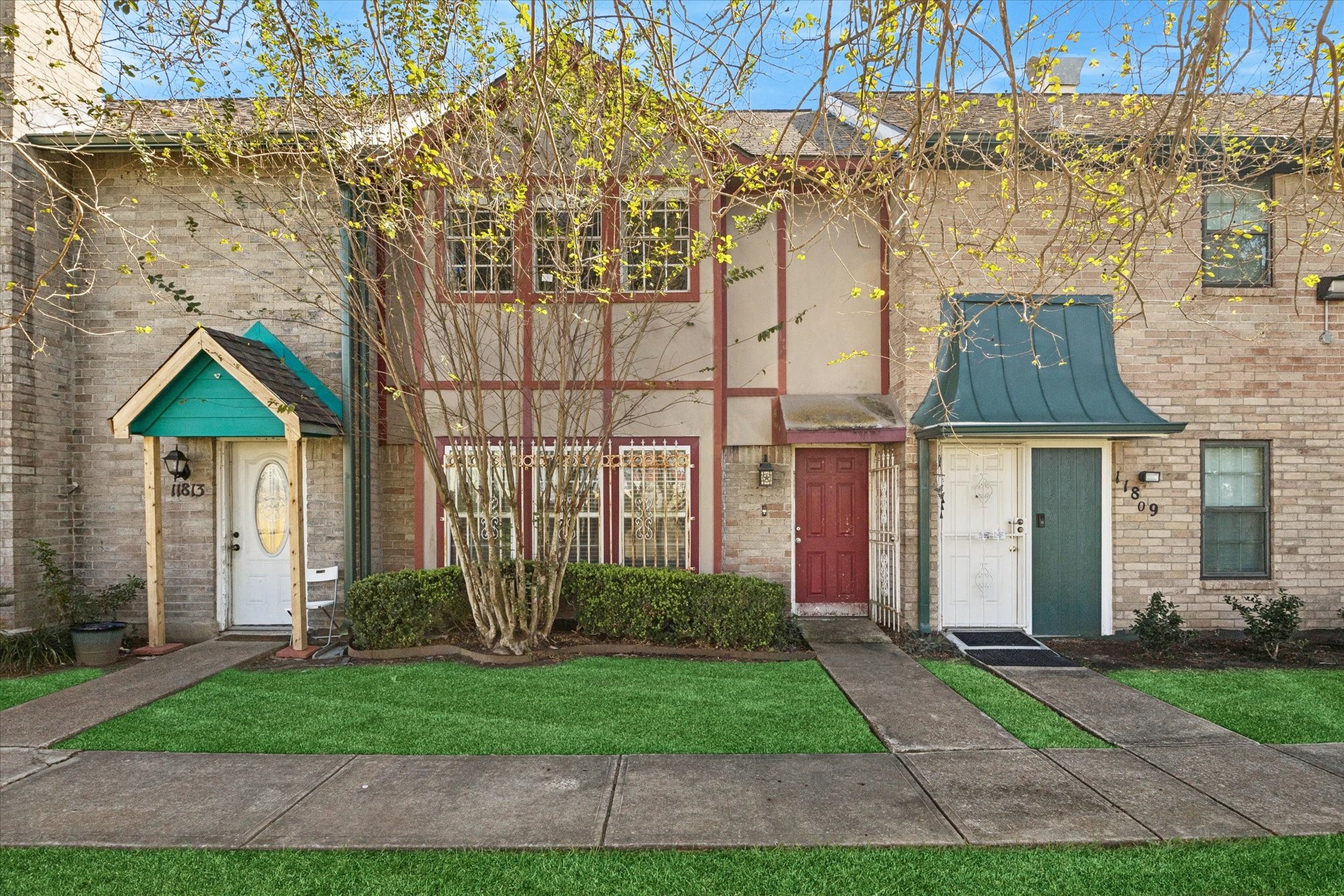 a front view of a house with garden