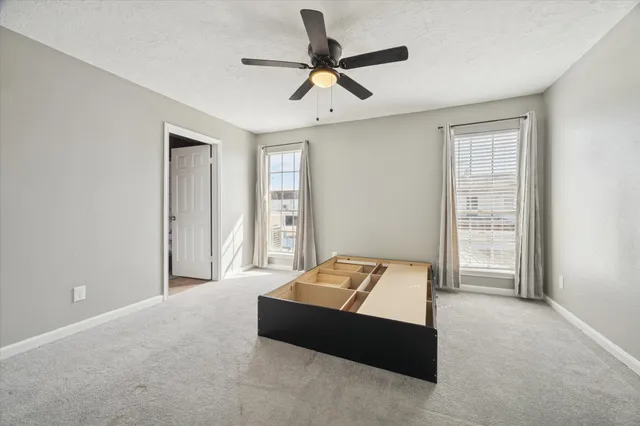 a room with bed and window