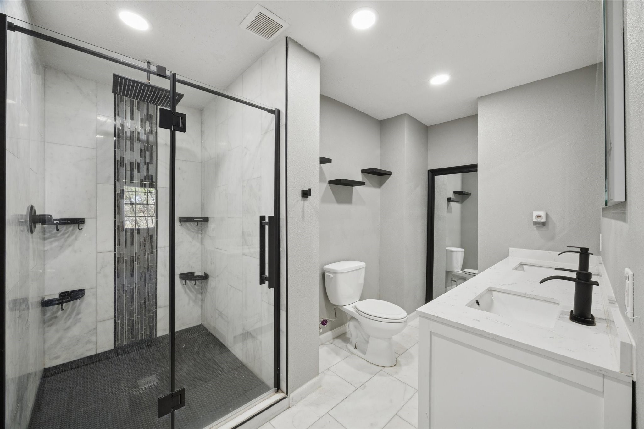 11811 Algonquin Drive Houston, TX 77089 - Photo 8 of 11 a bathroom with a sink toilet and shower