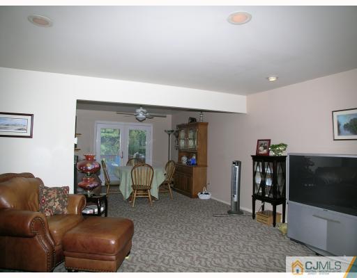 2 Lynnwood Road Edison, NJ 08820 - Photo 7 of 8 a living room with furniture and a flat screen tv