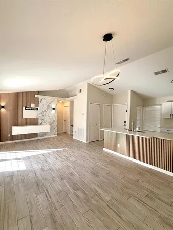 a view of a livingroom with wooden floor