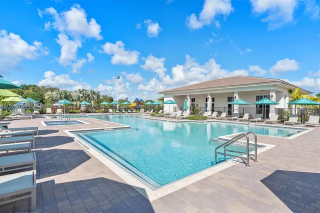 a view of swimming pool with outdoor seating