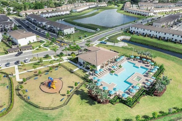 an aerial view of a swimming pool and outdoor space