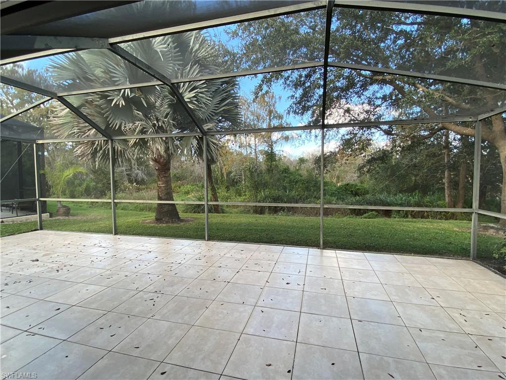 7057 Timberland Circle Naples, FL 34109 - Photo 13 of 22 a view of a backyard