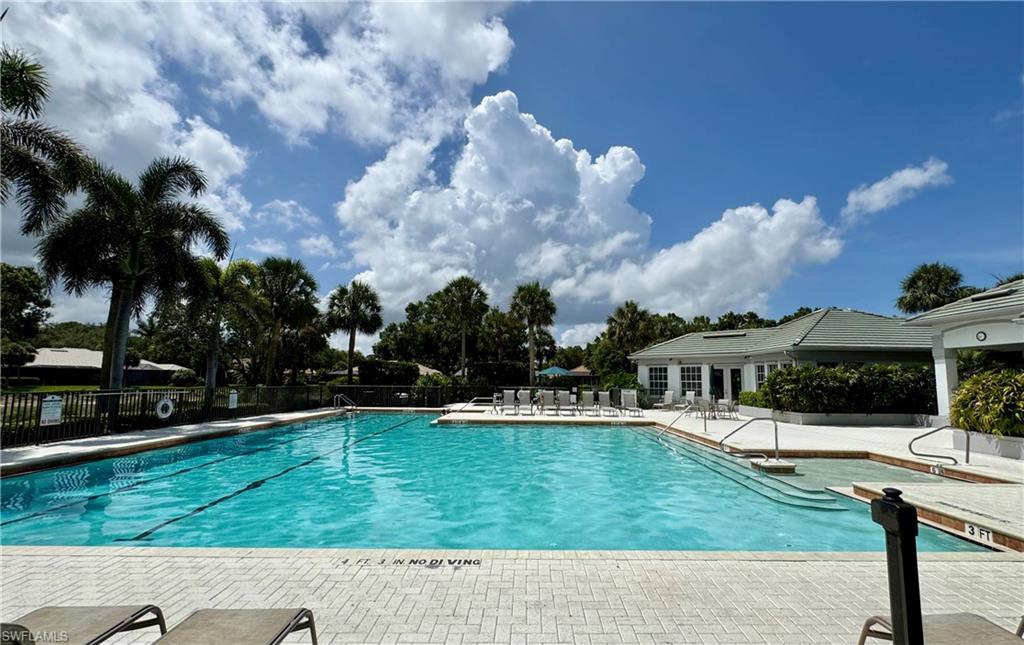 7057 Timberland Circle Naples, FL 34109 - Photo 16 of 22 a view of house with outdoor space and seating area