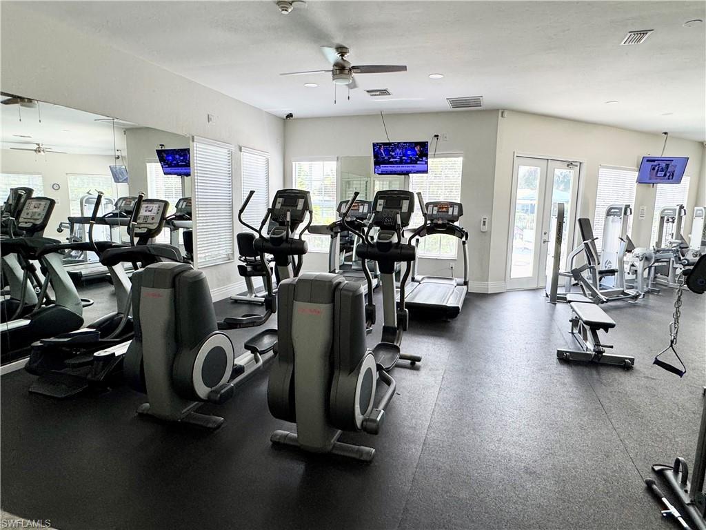 7057 Timberland Circle Naples, FL 34109 - Photo 18 of 22 a view of a room with gym equipment