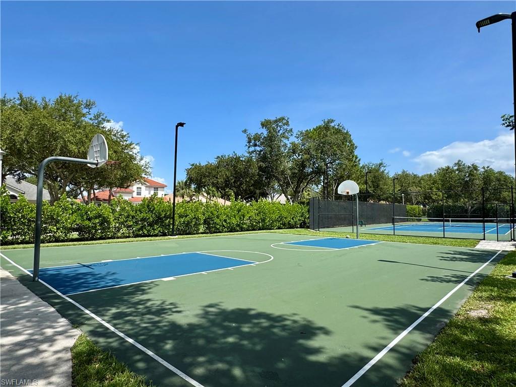 7057 Timberland Circle Naples, FL 34109 - Photo 20 of 22 a view of a tennis court