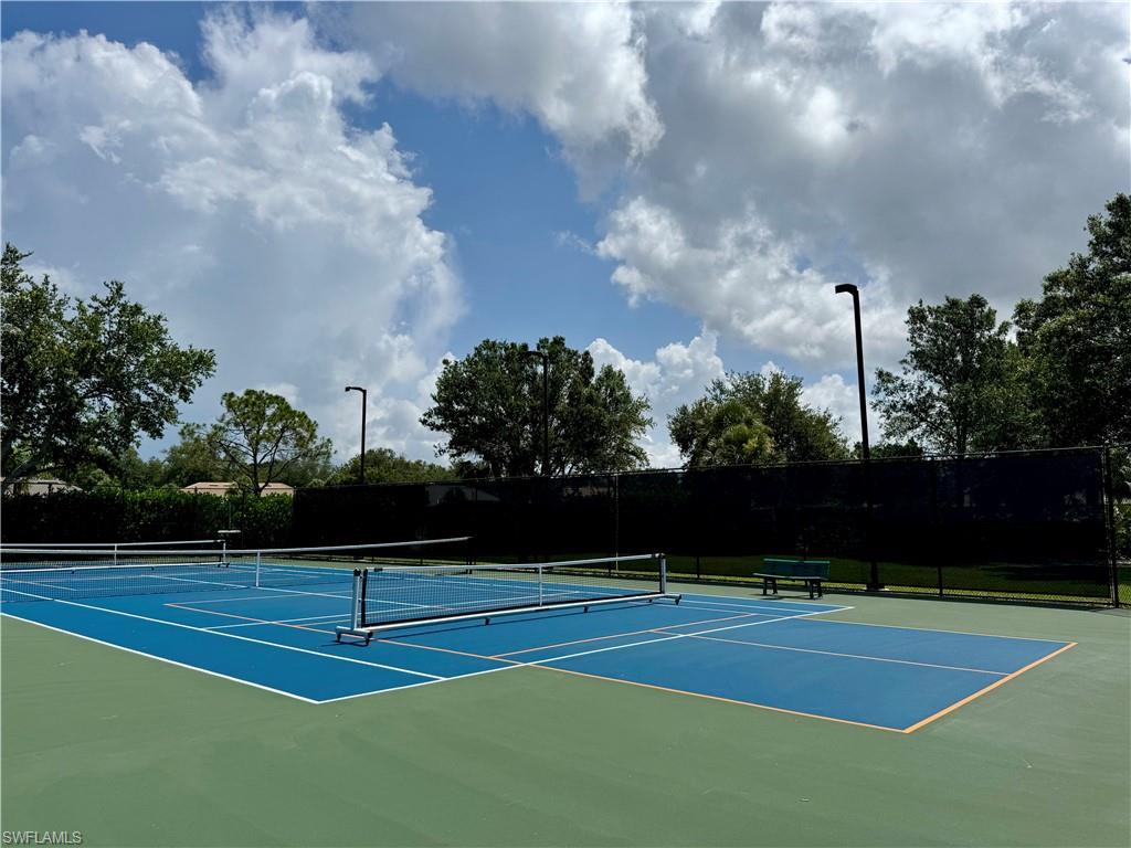 7057 Timberland Circle Naples, FL 34109 - Photo 21 of 22 a view of a tennis court