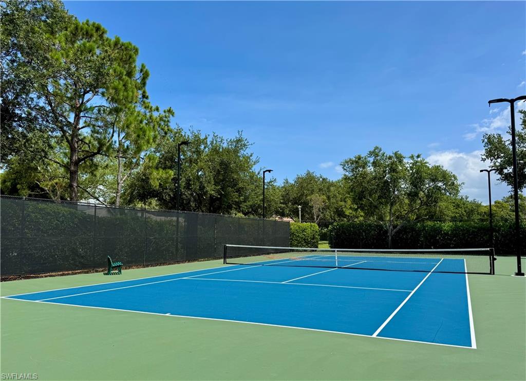 7057 Timberland Circle Naples, FL 34109 - Photo 22 of 22 a view of a tennis court