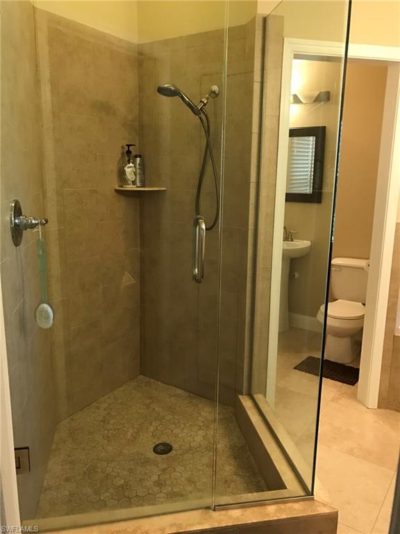 7057 Timberland Circle Naples, FL 34109 - Photo 8 of 22 a bathroom with a shower