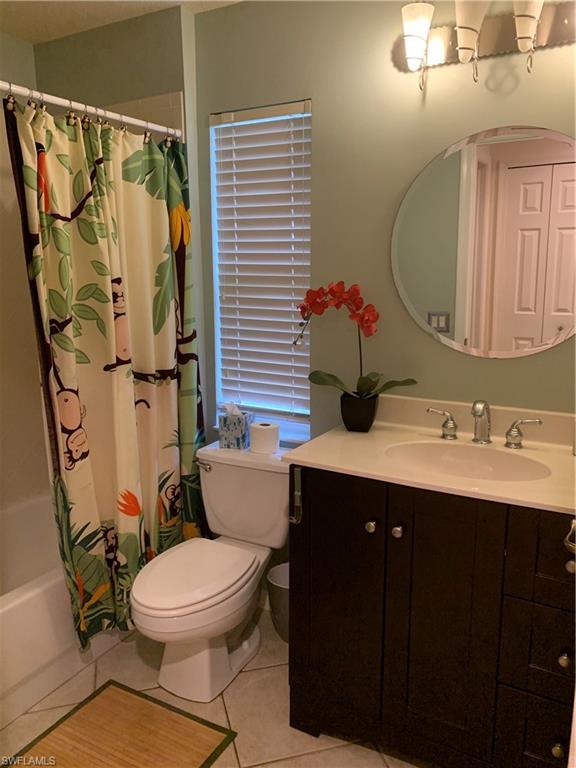 7057 Timberland Circle Naples, FL 34109 - Photo 10 of 22 a bathroom with a sink toilet and shower