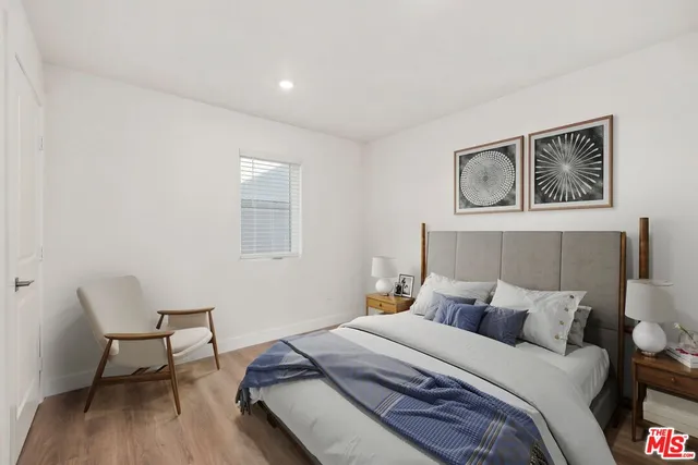 a bedroom with a bed and a desk