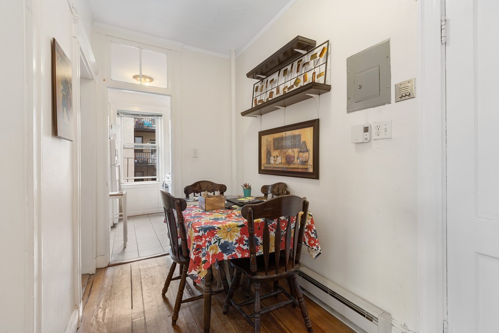 316 Summit Avenue, Unit 6 Boston, MA 02135 - Photo 5 of 9 a view of a dining room with furniture and wooden floor