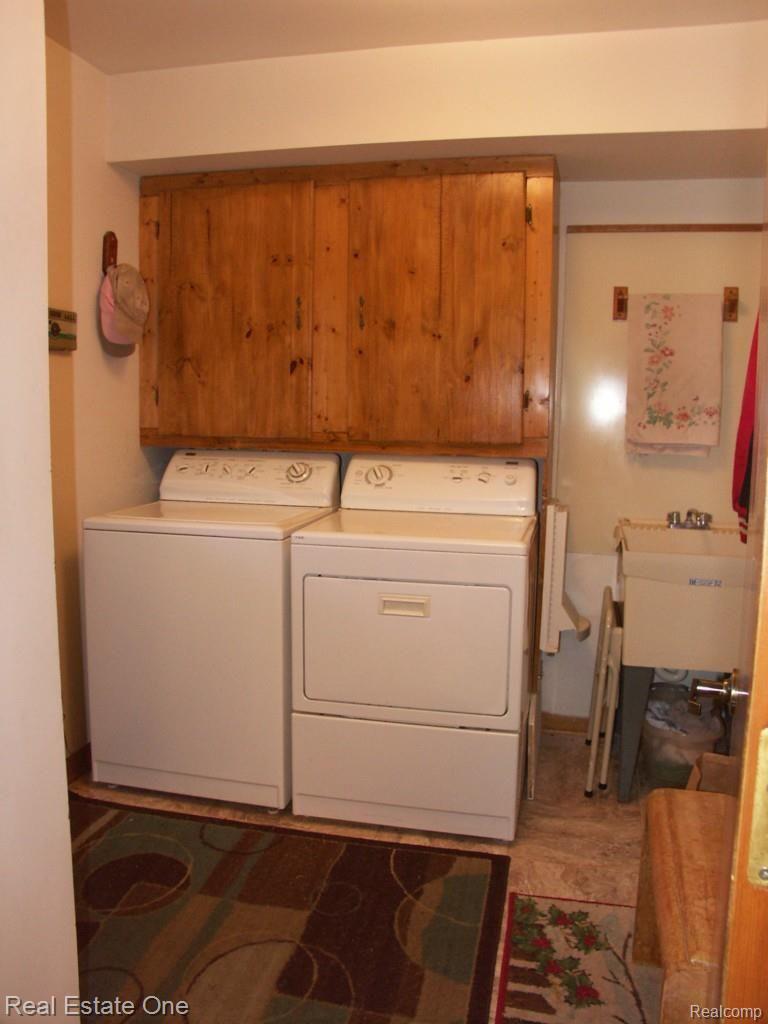 1470 Ranch Road Holly, MI 48442 - Photo 29 of 63 Entry level laundry off the kitchen