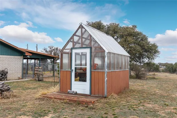 a swimming pool with outdoor seating and yard