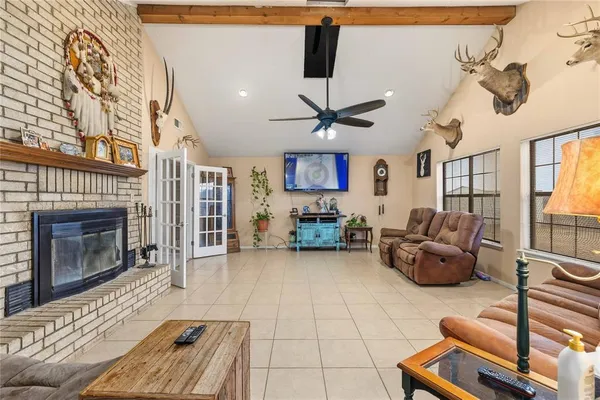 a living room with furniture and a fireplace