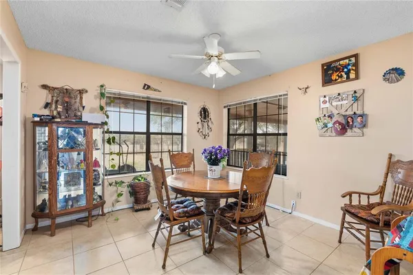 a dining room with furniture and window