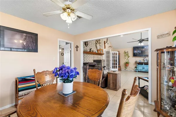 a dining room with furniture and chandelier