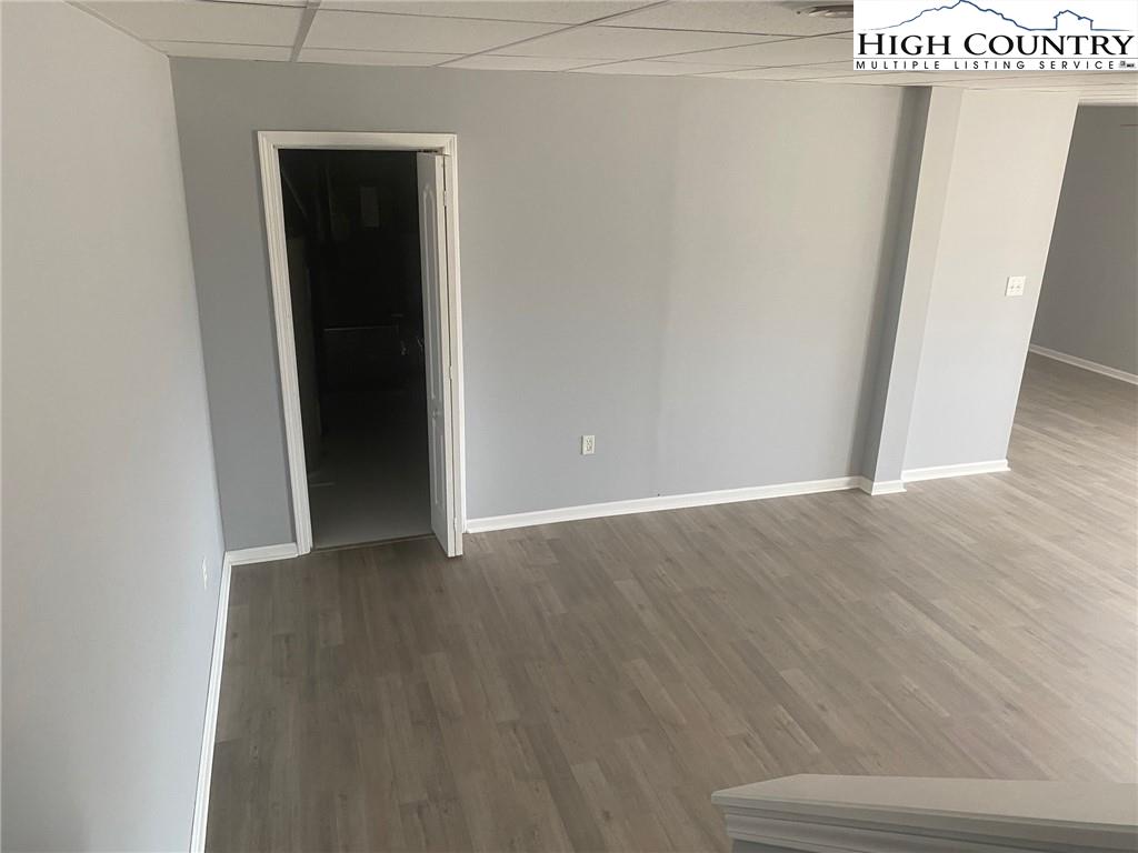125 Moxley Ridge Road Sparta, NC 28675 - Photo 16 of 30 a view of an empty room with wooden floor