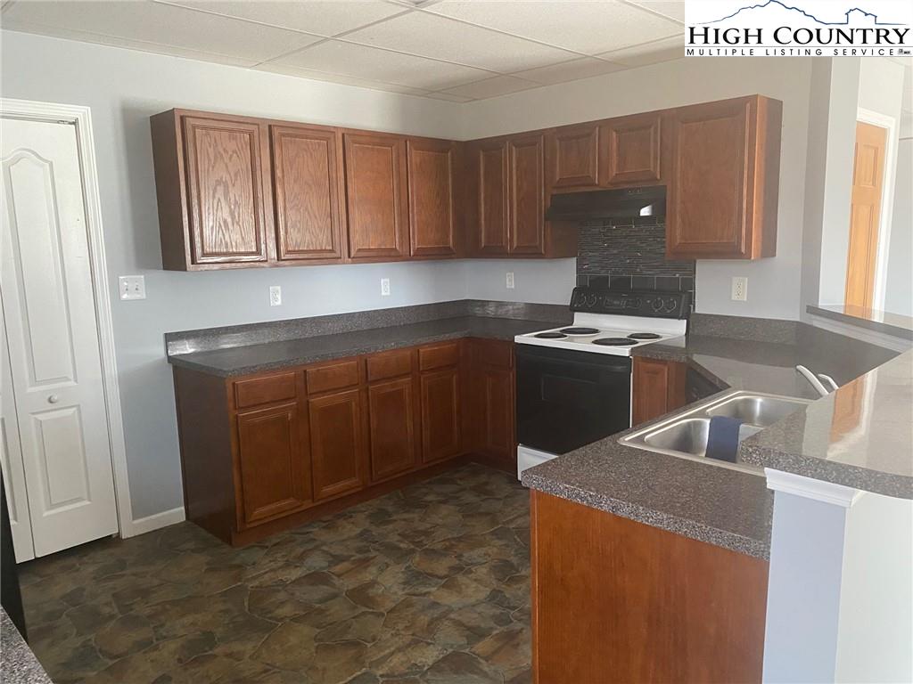 125 Moxley Ridge Road Sparta, NC 28675 - Photo 24 of 30 a kitchen with sink cabinets and window