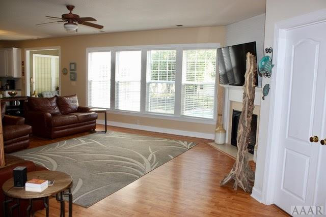 332 Green View Road Moyock, NC 27958 - Photo 3 of 17 Living room, view into sunroom and corner of kitch