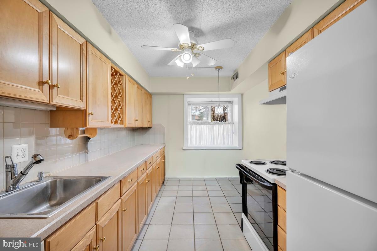223 James Marlton, NJ 08053 - Photo 8 of 28 a kitchen with granite countertop stainless steel appliances a sink stove top oven and cabinets