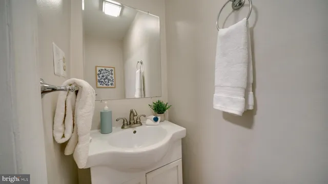 a bathroom with a sink and mirror