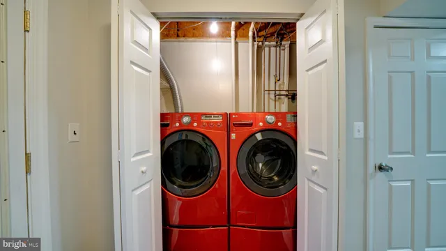 a view of a backyard with chairs and a fence