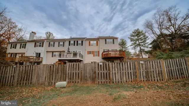 aerial view of a house with large trees