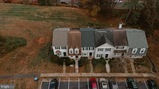 an aerial view of a house with outdoor seating