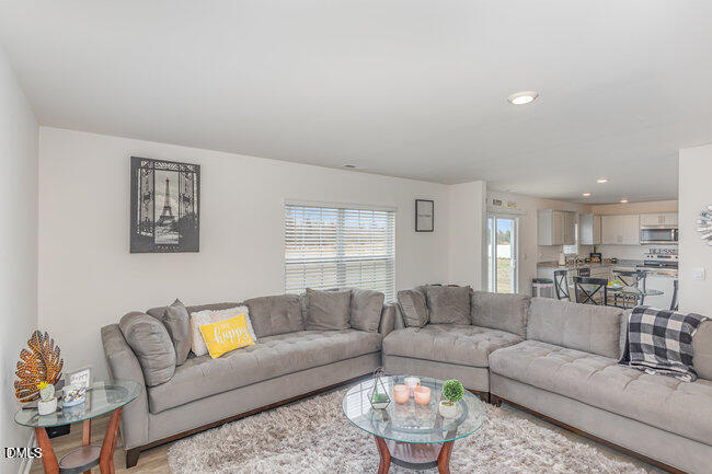 7629 Sand Pit Road Stantonsburg, NC 27883 - Photo 3 of 3 a living room with furniture and a large window