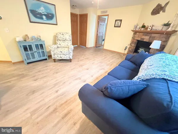 a living room with furniture and painting on the wall