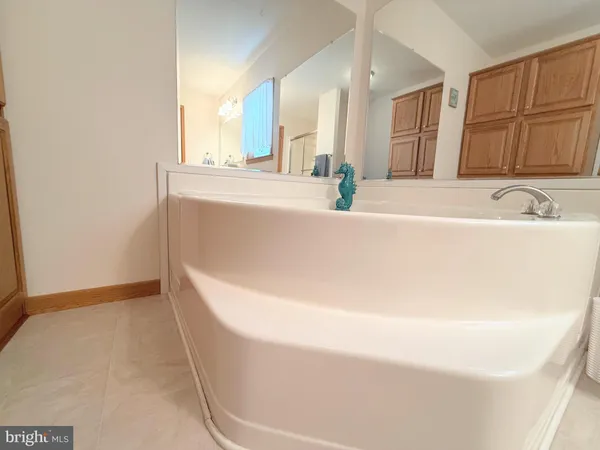 a bathroom with a bathtub and a sink