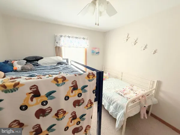 a bedroom with a bed and a table in it