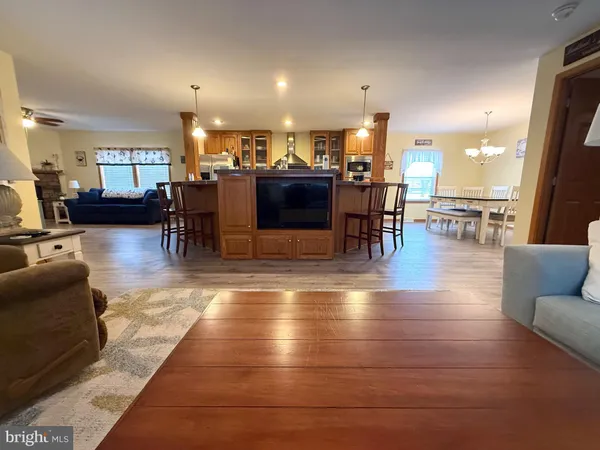 a living room with furniture and kitchen view