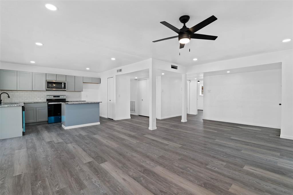 2068 East Peters Colony Road Carrollton, TX 75007 - Photo 4 of 24 a view of kitchen with wooden floor and window