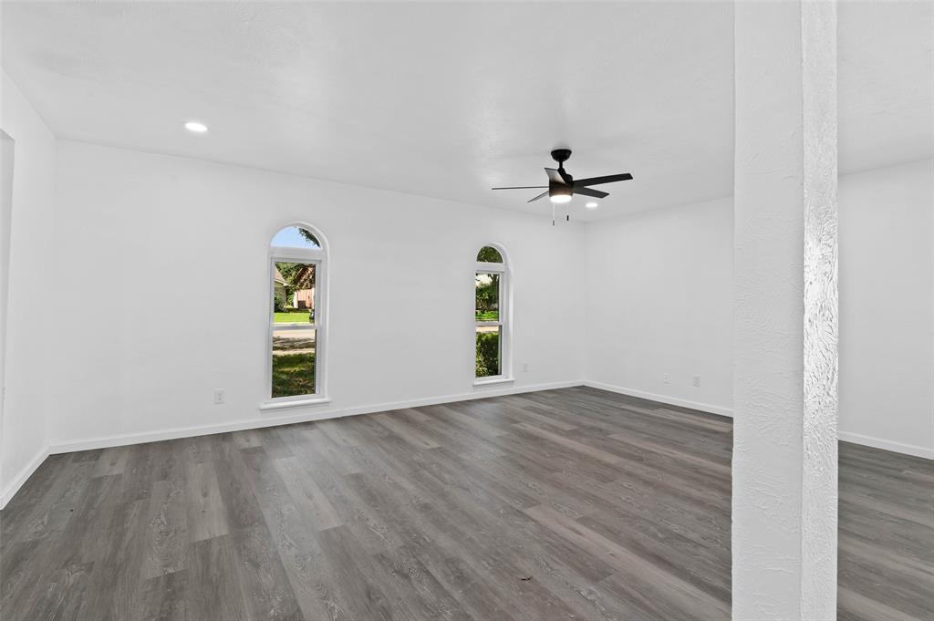 2068 East Peters Colony Road Carrollton, TX 75007 - Photo 8 of 24 wooden floor in an empty room with a window