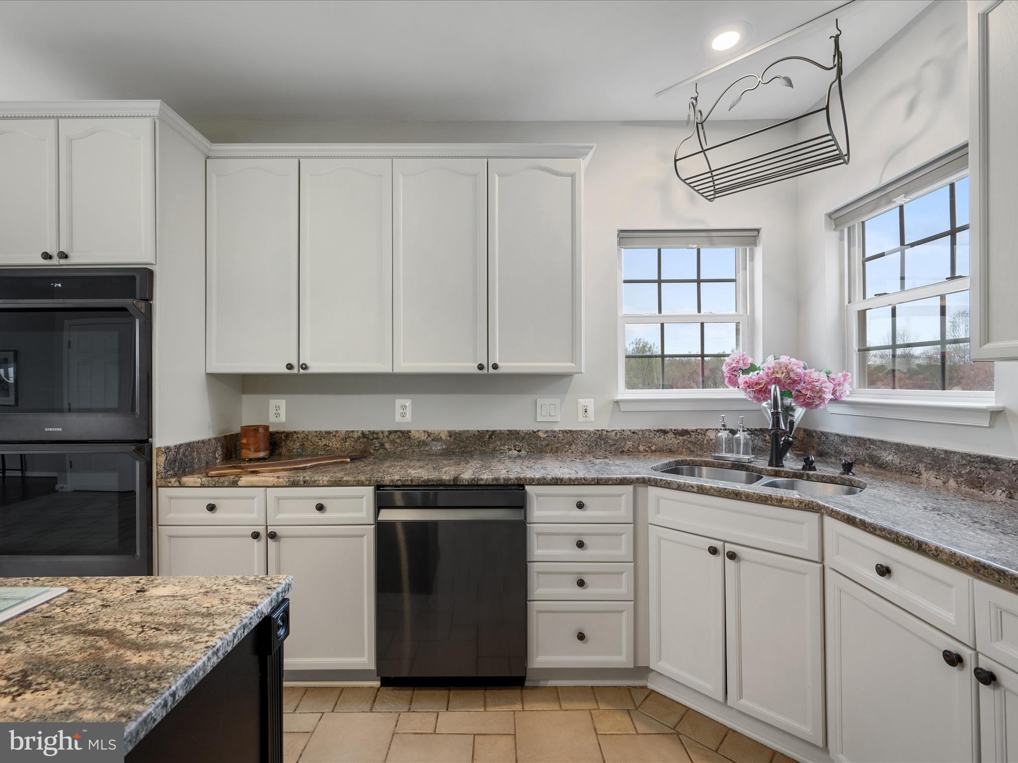 26 Limestone Way Fredericksburg, VA 22406 - Photo 18 of 67 a kitchen with granite countertop a sink stove and cabinets