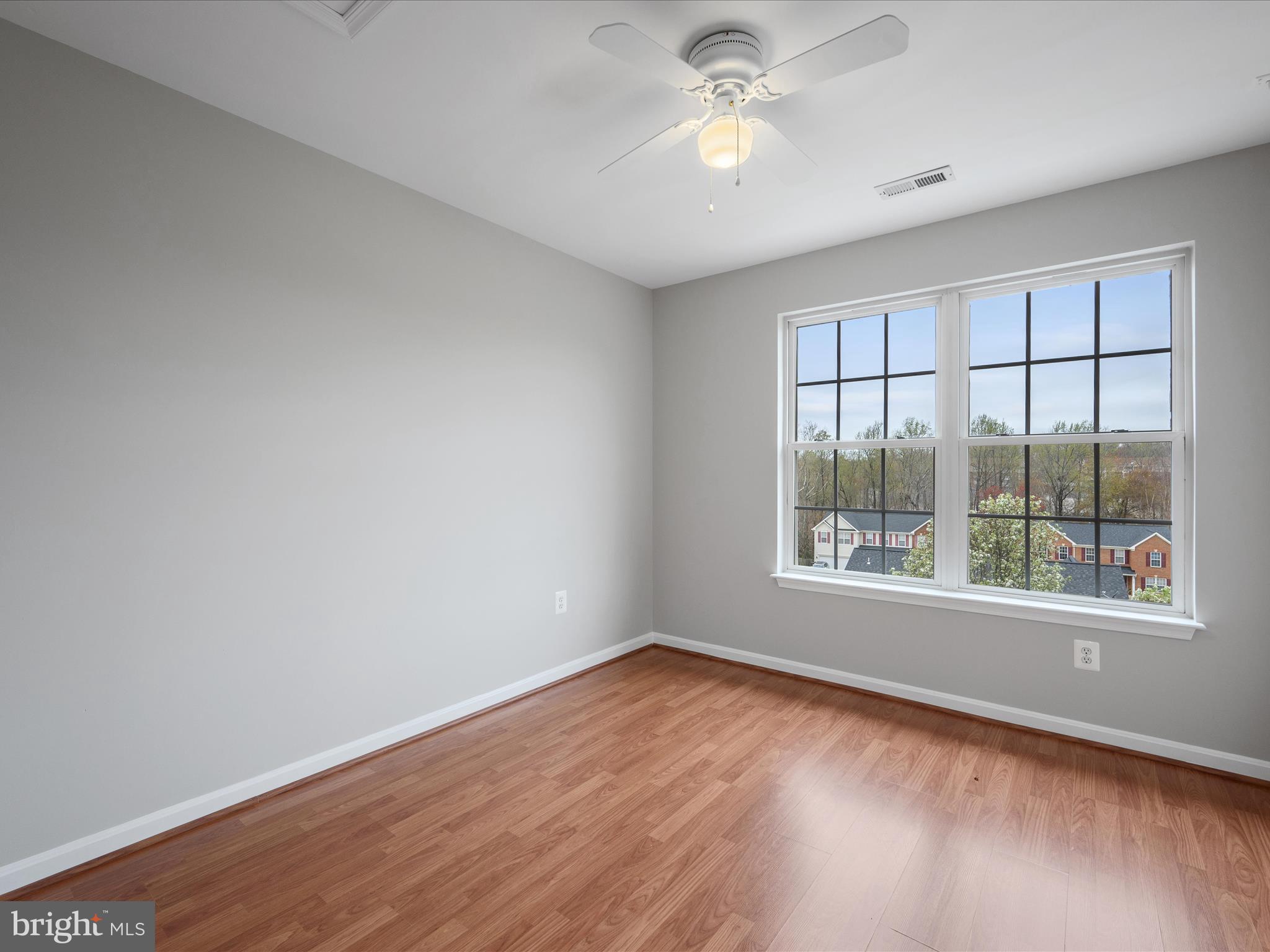26 Limestone Way Fredericksburg, VA 22406 - Photo 35 of 67 an empty room with wooden floor and windows