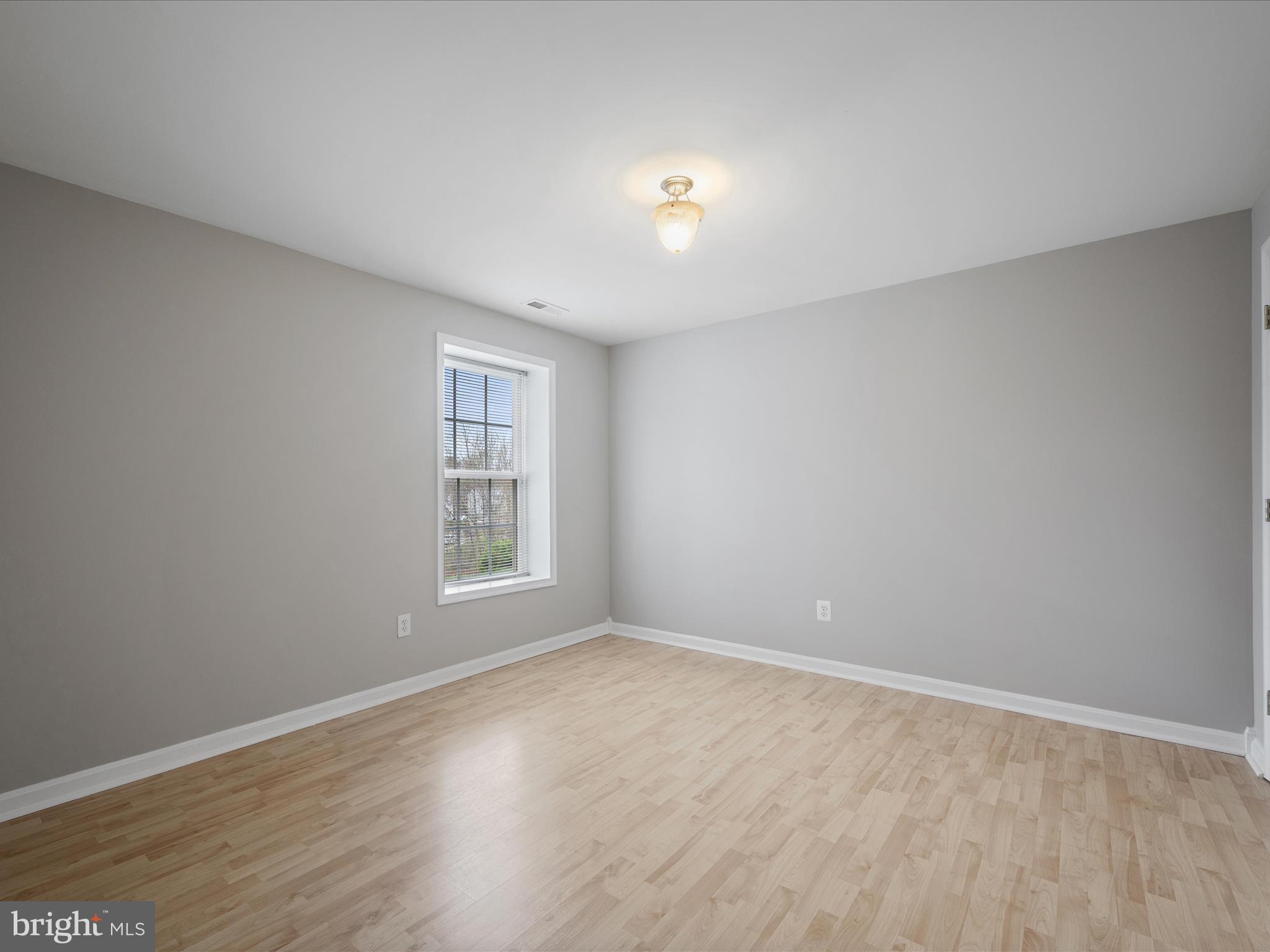 26 Limestone Way Fredericksburg, VA 22406 - Photo 47 of 67 a view of an empty room with wooden floor and a window