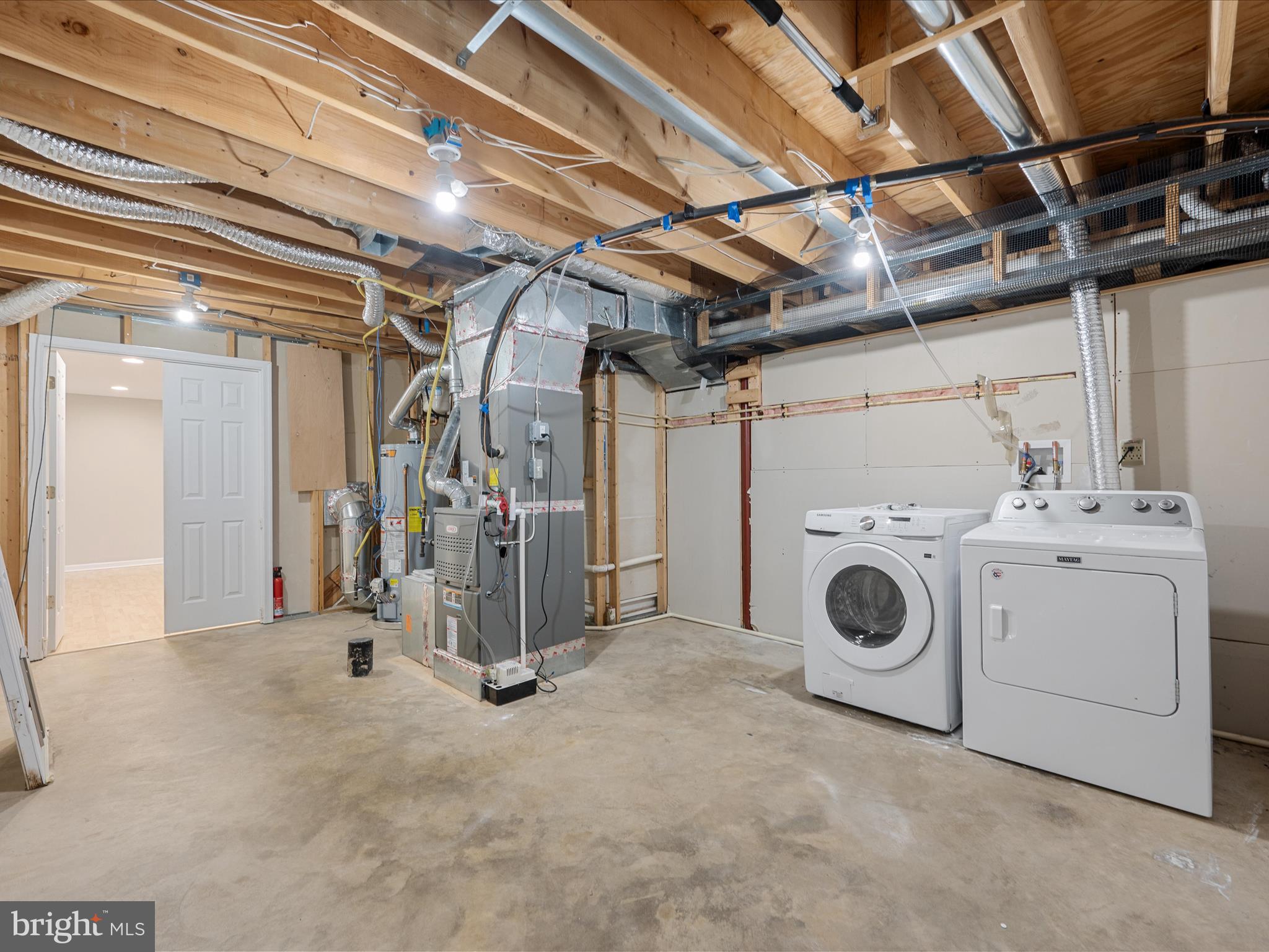 26 Limestone Way Fredericksburg, VA 22406 - Photo 49 of 67 a view of a storage & utility room with dryer and washer