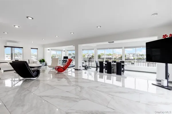 a living room with lots of furniture and white walls