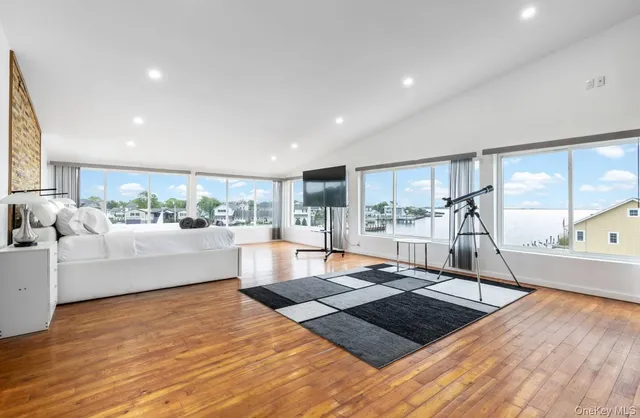 a living room with couch and wooden floor